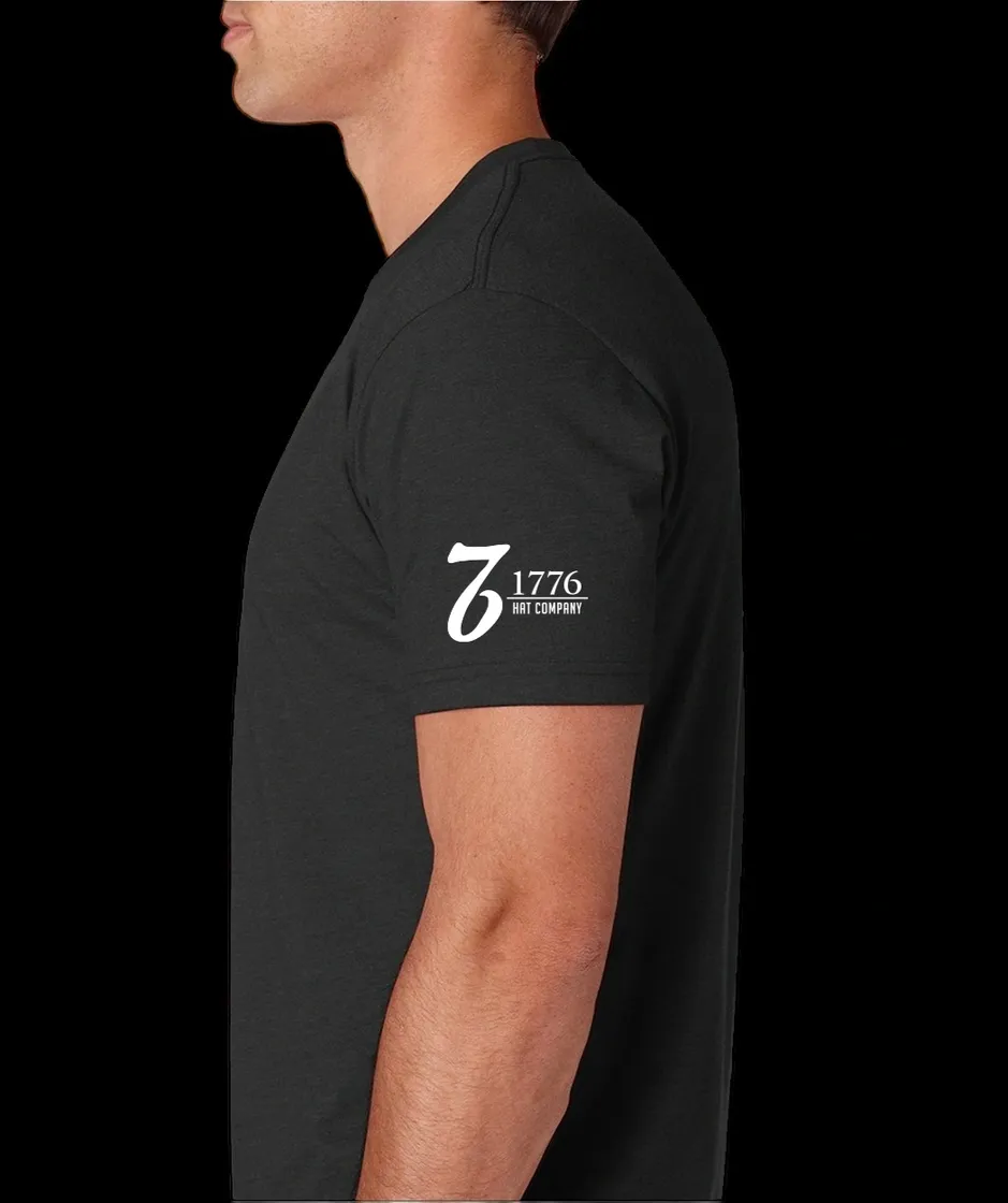 A man wearing a black t-shirt with the number seven.