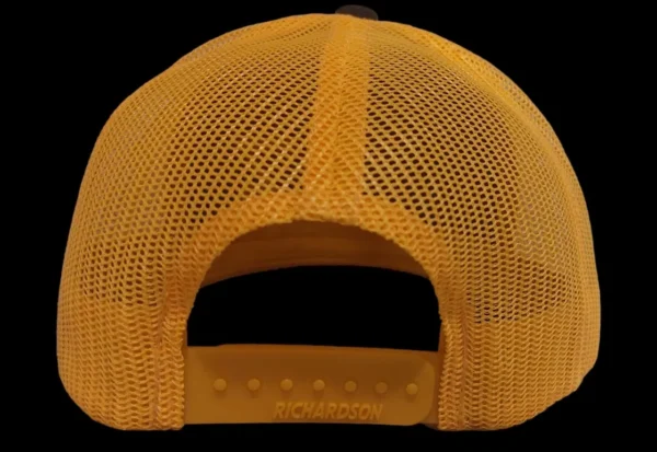 A yellow hat with a black and white logo.