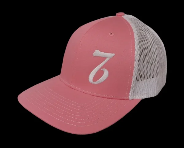 A pink and white hat with the number seven on it.