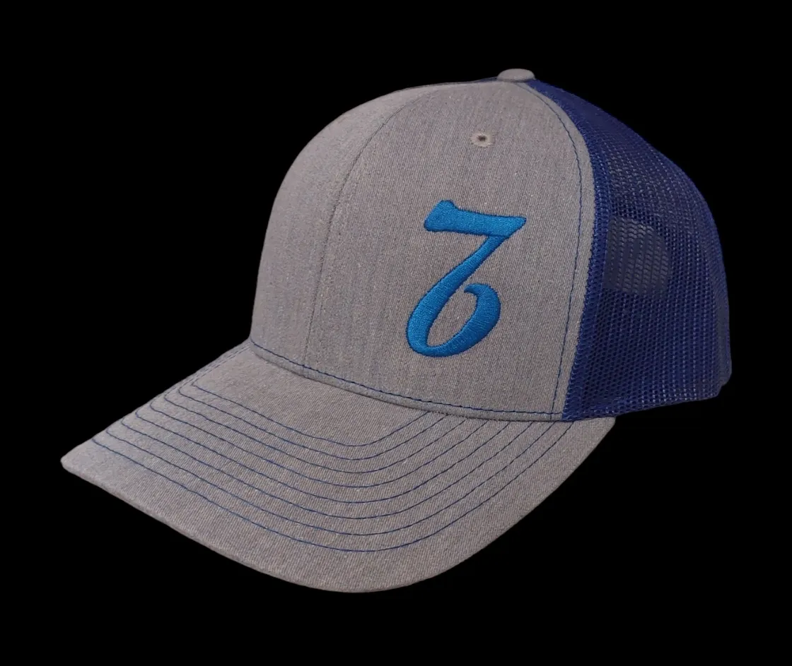 A gray and blue hat with the number seven on it.