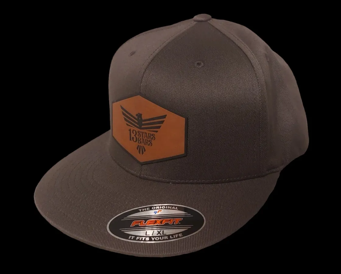 A brown hat with an orange patch on it