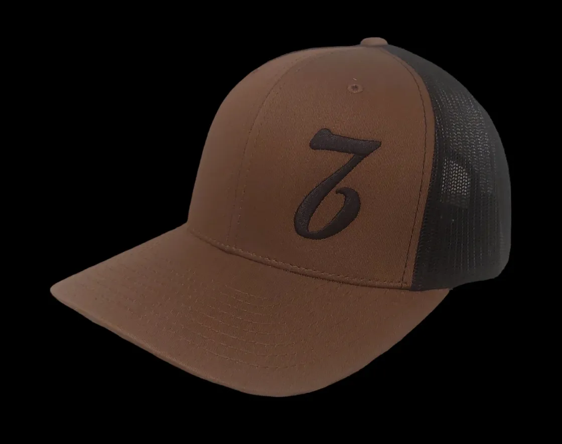 A brown and black hat with the number seven on it.