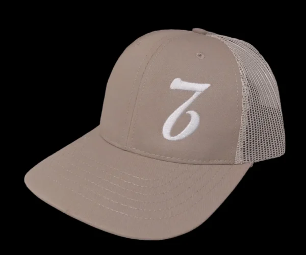 A tan hat with the number seven on it.