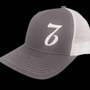 A gray and white hat with the number seven on it.