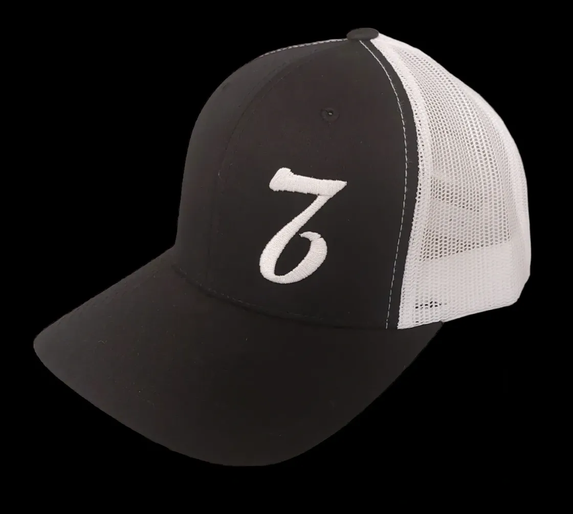 A black and white hat with the number seven on it.