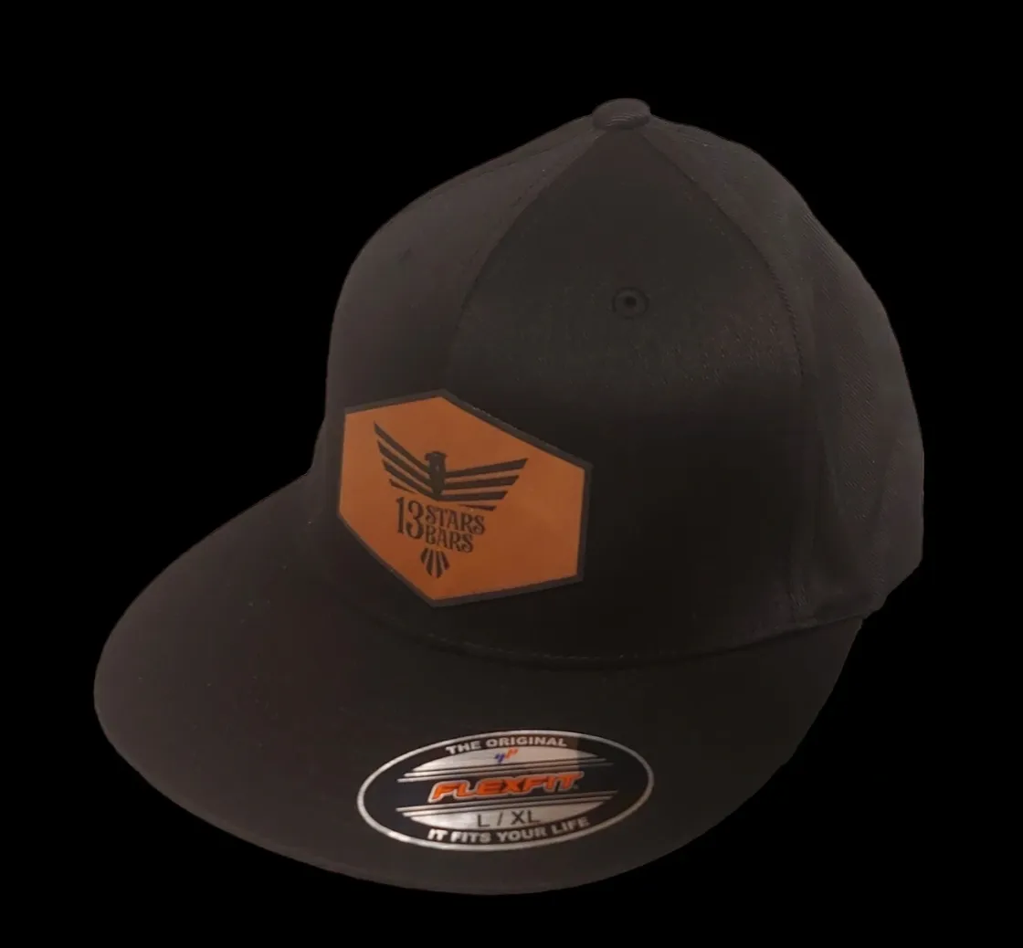 A black hat with an orange patch on the front.